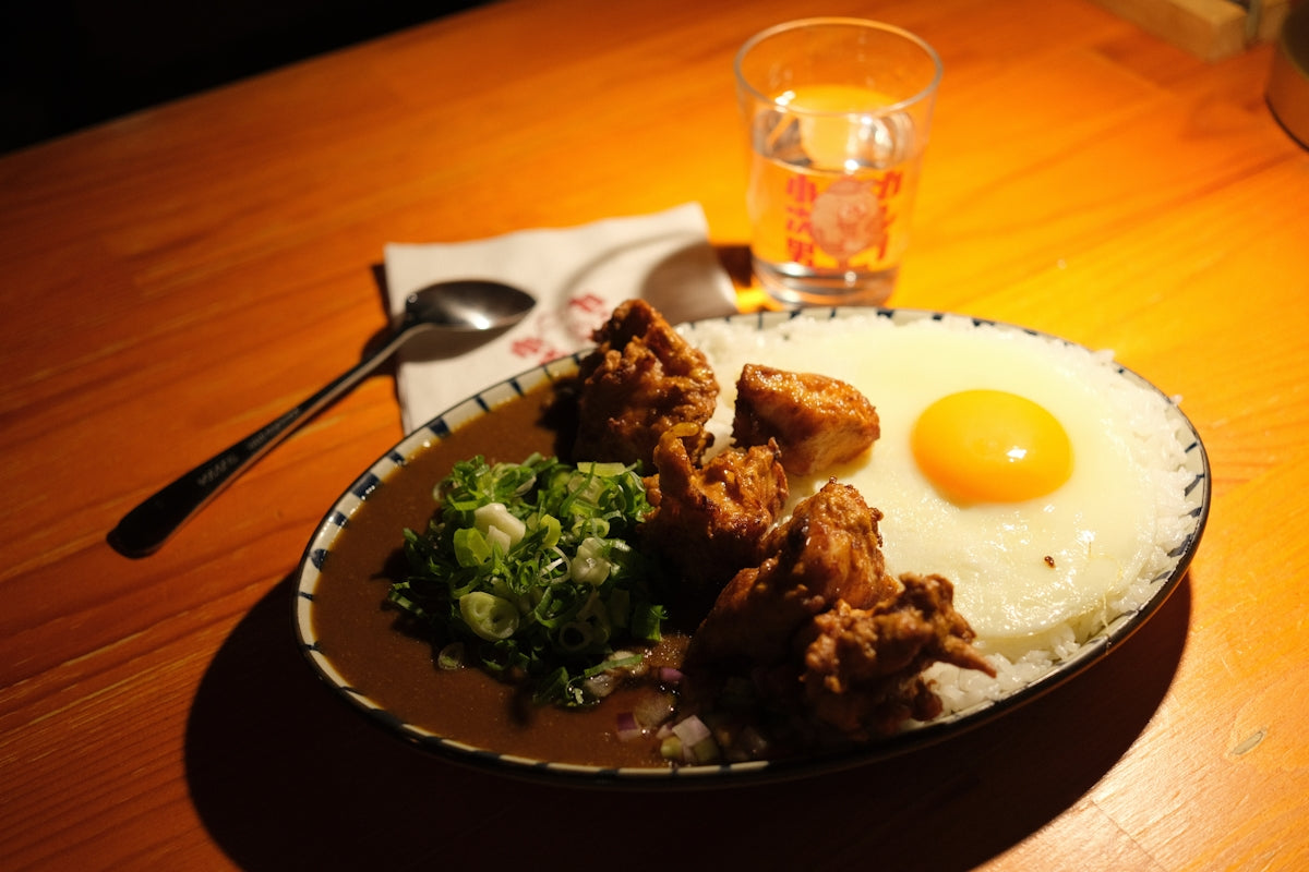 Fried chicken curry rice with egg and greens